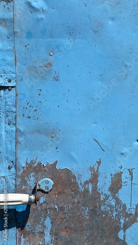 Weathered Blue-Painted Metal Surface with Peeling Paint, Rust Stains, and Industrial Fasteners — Grunge Texture for Design