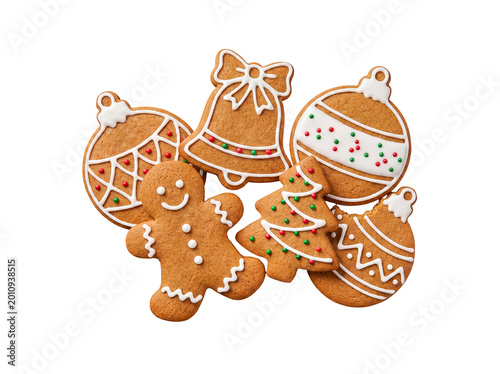 Fotografija Festive homemade gingerbread cookies in classic Christmas shapes, decorated with white icing and colorful sprinkles