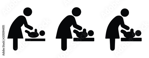 Fotografia Baby changing station icon set, black silhouette of mother nursing infant, nurse