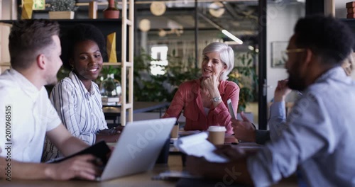 Business meeting, collaboration and teamwork in boardroom, planning and people or brainstorming. Staff, senior woman and leadership at conference, discussion and support or communication for review