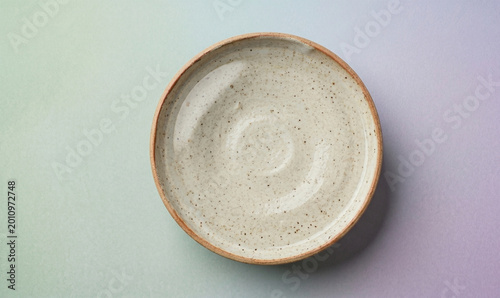 Ceramic serving plate top view, minimalist stoneware dinnerware, neutral artisan pottery dish, modern kitchen tableware photography, handmade speckled clay plate, clean food presentation surface, arti
