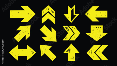 Set of yellow grunge arrow icons with distressed texture on black background pointing in various directions for navigation and design