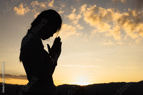 Women raise their hands to ask for blessing from God. Spiritual person prays having faith. Power of hope or love and devotion.