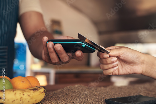 Bild auf Leinwand Payment, pos machine or hands with credit card in restaurant, electronic money transfer or tapping