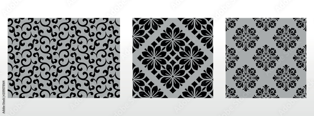 Obraz premium Geometric floral set of seamless patterns. Gray and black vector backgrounds. Damask graphic ornaments