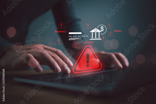 Photos Cybersecurity warning alert for online banking fraud and financial risk detection on laptop with digital threat notification and secure transaction monitoring