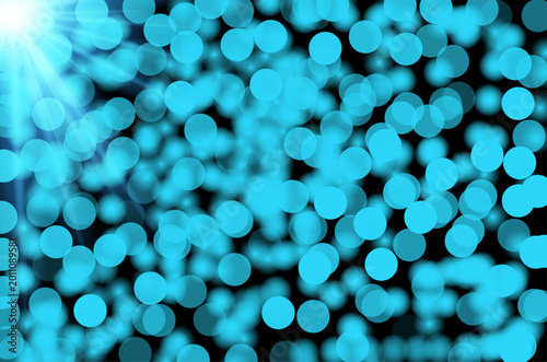 Abstract turquoise bokeh lights background with bright flare
