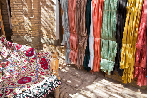 Photography OLD TRADITIONAL MARKET IN KHIVA WITH HANDICRAFTS COLORED FABRICS FOR SALE IN A M