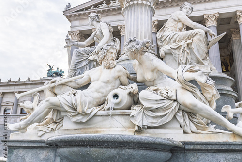 Canvas-taulu Detail of allegorical marble sculptures at the Pallas Athene fountain in front o