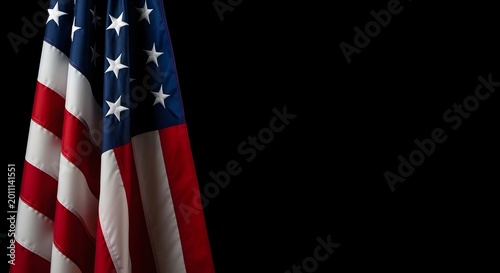American flag hanging vertically against a black background, high contrast patriotic composition with copy space