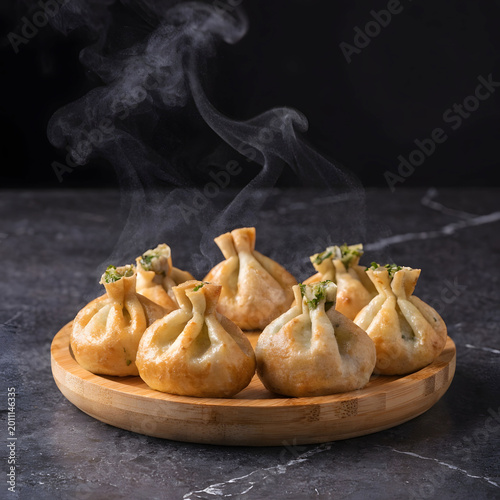 bamboo platter with small kutabs stuffed flatbread