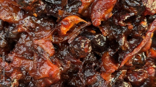 Obraz na plátně Intensely flavorful dark red and brown preserved plums or dates with a luscious,