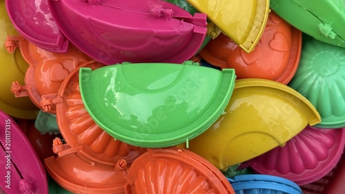 Cuadro en lienzo An exciting jumble of brightly colored plastic jelly molds showcasing various sh