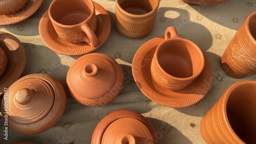 Billede på lærred Assortment of beautiful traditional terracotta pottery, including cups, saucers,