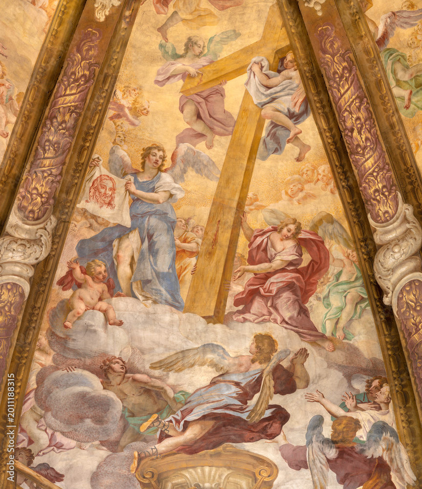 Obraz premium CREMA, ITALY - MARCH 20, 2026: The fresco of angels with the Crucifixion instruments (cross) in cupola of the church Santuario di Santa Maria della Croce by Giacomo Parravicino (1702). 