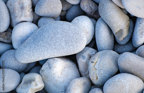 Canvas-taulu Detailed macro photography of smooth natural grey stones resting on a beach