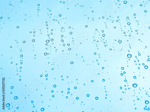 Photography Water drops on blue glass surface background