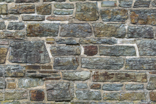 Rustic stone masonry wall texture background