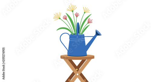 Blue watering can filled with colorful wildflowers resting on a small wooden folding stool against a white background.