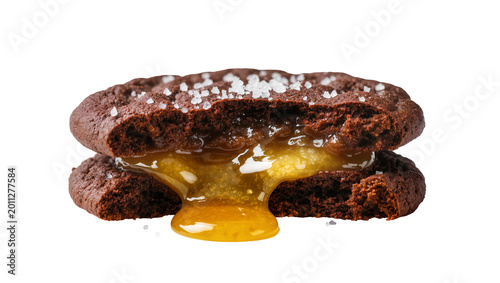 Tableau sur toile Rich dark chocolate cookie sandwich with gooey salted caramel filling, isolated
