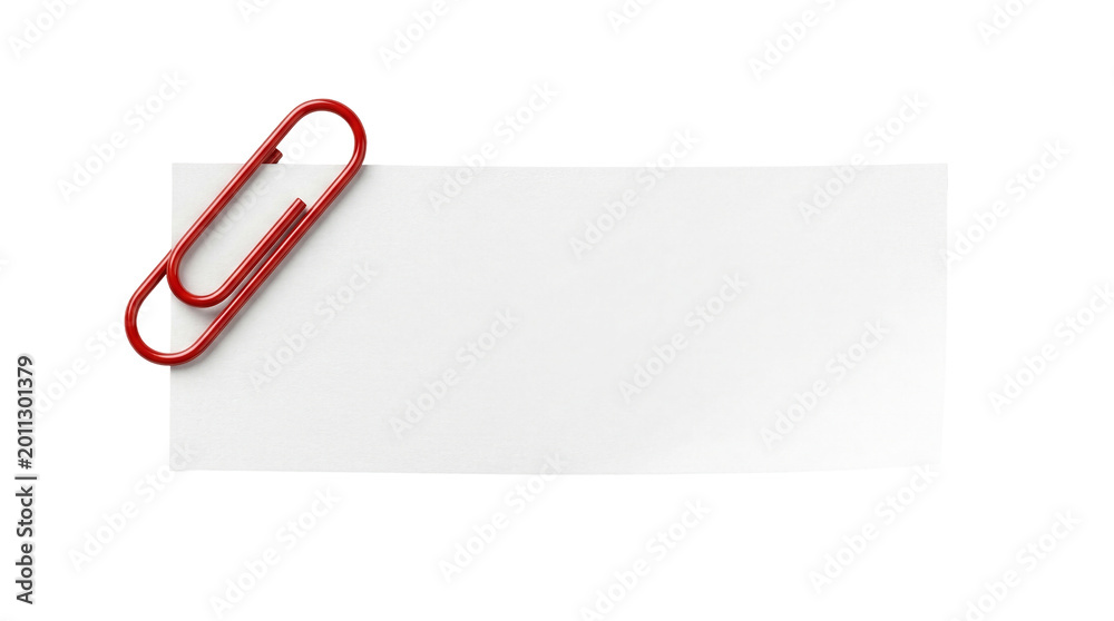 Fototapeta premium A white piece of paper clipped with a red paper clip