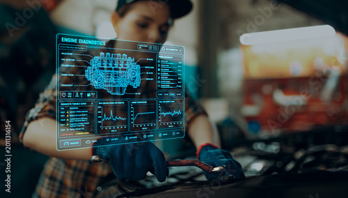 Εκτύπωση καμβά Female mechanic repairing car engine with holographic diagnostics interface