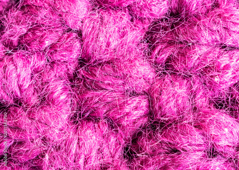 Obraz premium Knitted woolen fabric pattern in rich magenta