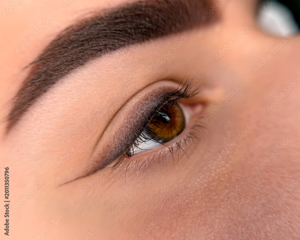 Obraz premium Permanent Eyeliner Makeup Procedure Beauty Eye Close-Up