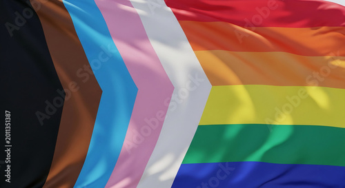 Close-up of a waving flag with rainbow, transgender, and intersectional pride stripes, symbolizing diversity, inclusion, and LGBTQ+ rights, representing community and celebration.