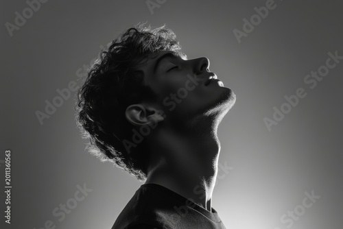 Silhouette of man in a black t-shirt on a white background, side view Black and white photo, Generative AI