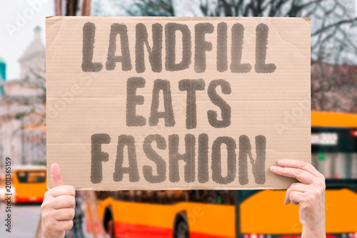 Slika na platnu "Landfill Eats Fashion" Millions of tons of discarded clothing enter waste streams annually worldwide