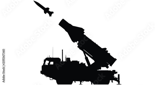 Photos Silhouetted missile launching from a mobile rocket launcher against a white back
