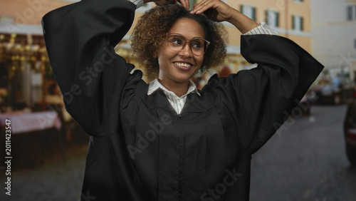 Photos Woman judge smiling with hands forming heart on street terrace outside restaurant; achievement celebration joy