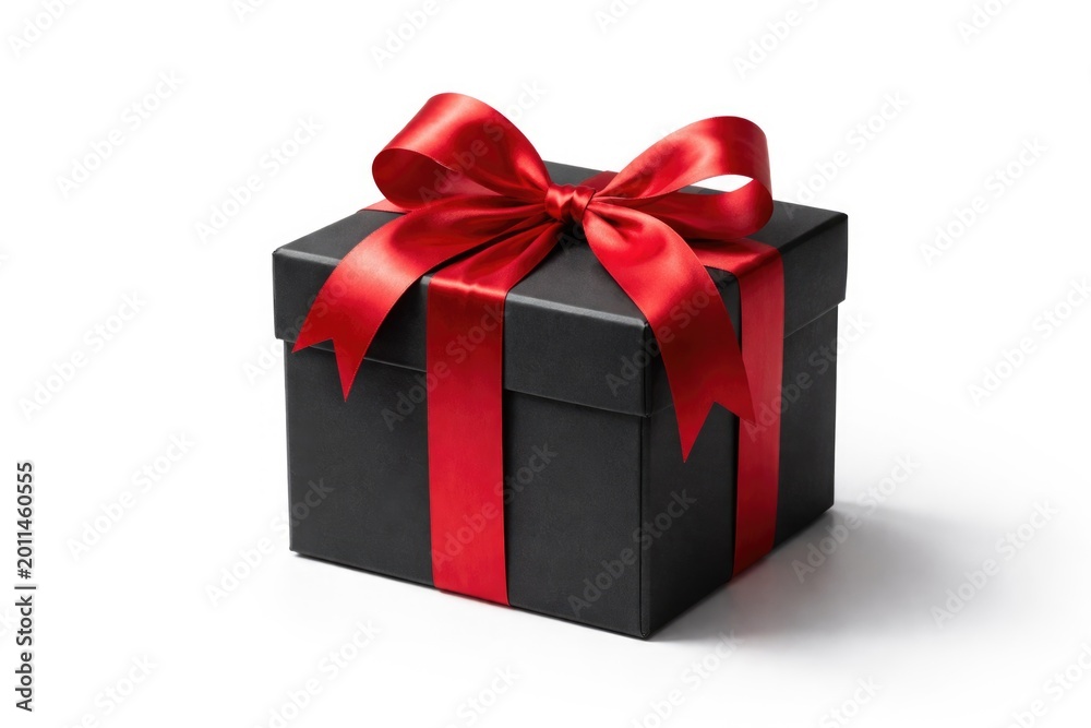 Fototapeta premium Stylish black gift box featuring a lively red ribbon on a flawless white background providing copy space