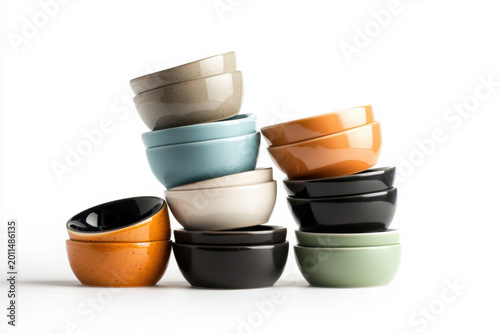 Ceramic ramekin set assorted color stacked bowl kitchen dish isolated background glossy glaze tableware collection modern style white background colorful ceramic