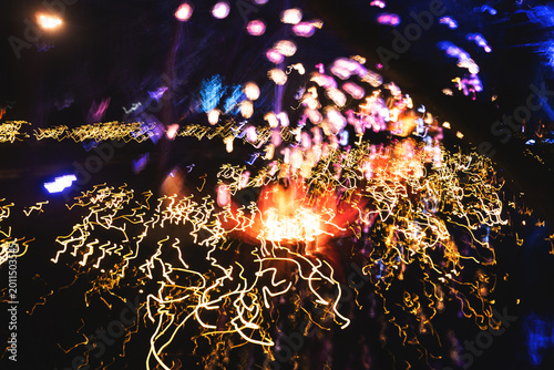 Canvastavla Abstract colorful light trails and neon motion blur at night with dynamic long e
