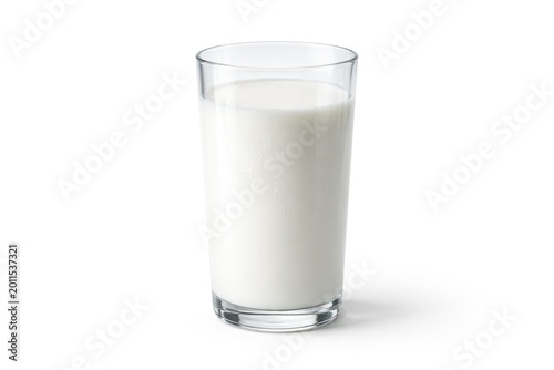 High detail picture of a transparent glass holding milk on a white plain backdrop