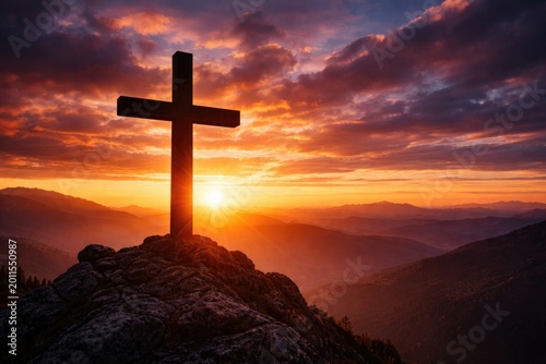 Silhouetted cross on a moun...