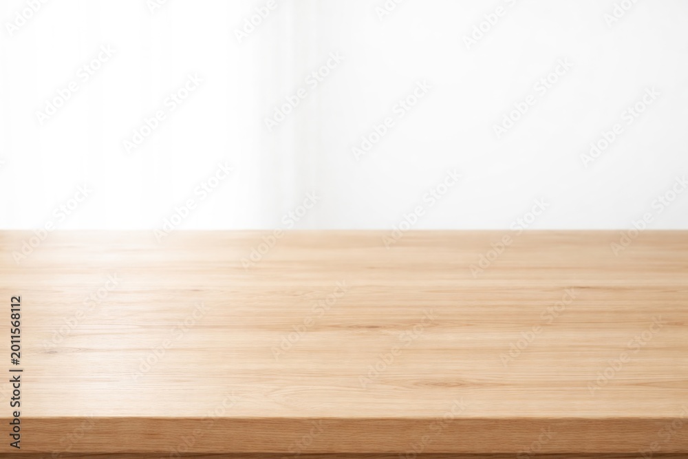 Fototapeta premium Minimalist wooden table surface with high key lighting and copy space