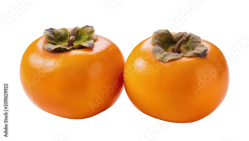 Fotografi Ripe orange persimmons with green calyxes side by side