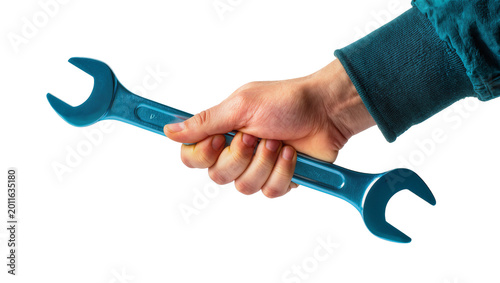 Obraz na plátně Teal wrench held by human hand wearing blue sweater