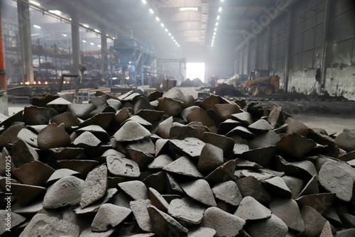 Pig iron raw material pile at industrial steel mill