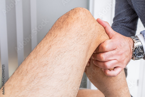 Orthopedic Doctor Examining Patient’s Knee