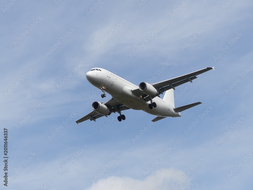 Obraz premium Airplane in the blue sky