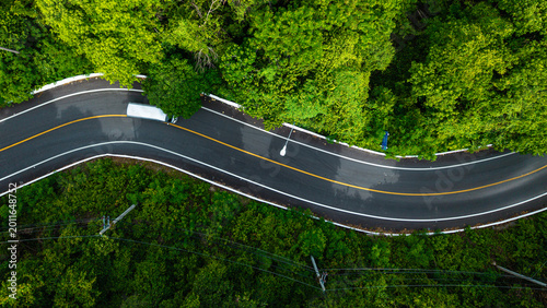 Aerial view asphalt road tropical rainforest transport