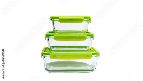 Fotografía Stack of three clear glass food storage containers with lime green locking lids,