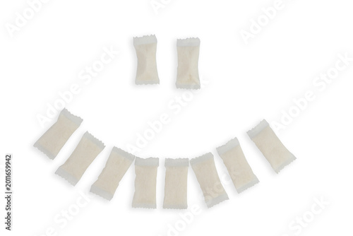 Canvastavla top view of several white nicotine pouches arranged to form a smiling face icon on a clean white surface in a bright studio with plenty of empty space