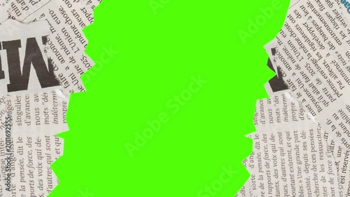 Newsprint and Chroma: A vibrant green screen peeks through torn newspaper, a creative juxtaposition of old and new media.