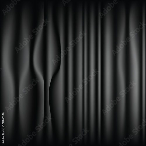 Dark gray curtain with wavy folds and soft lighting effects
