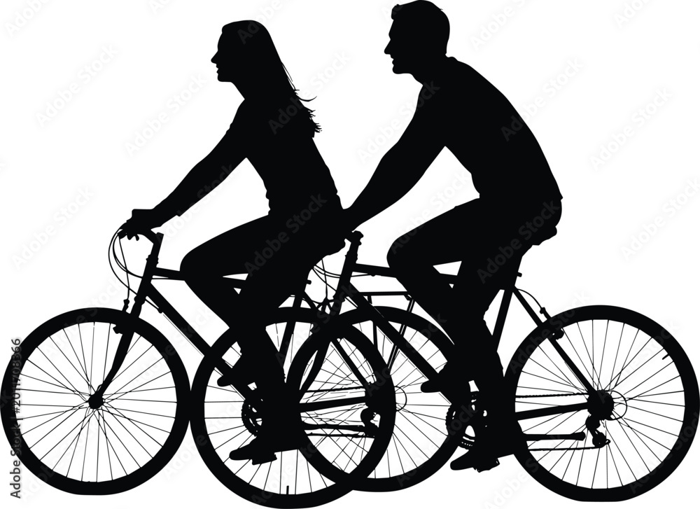 Fototapeta premium Silhouetted couple riding tandem bicycle together